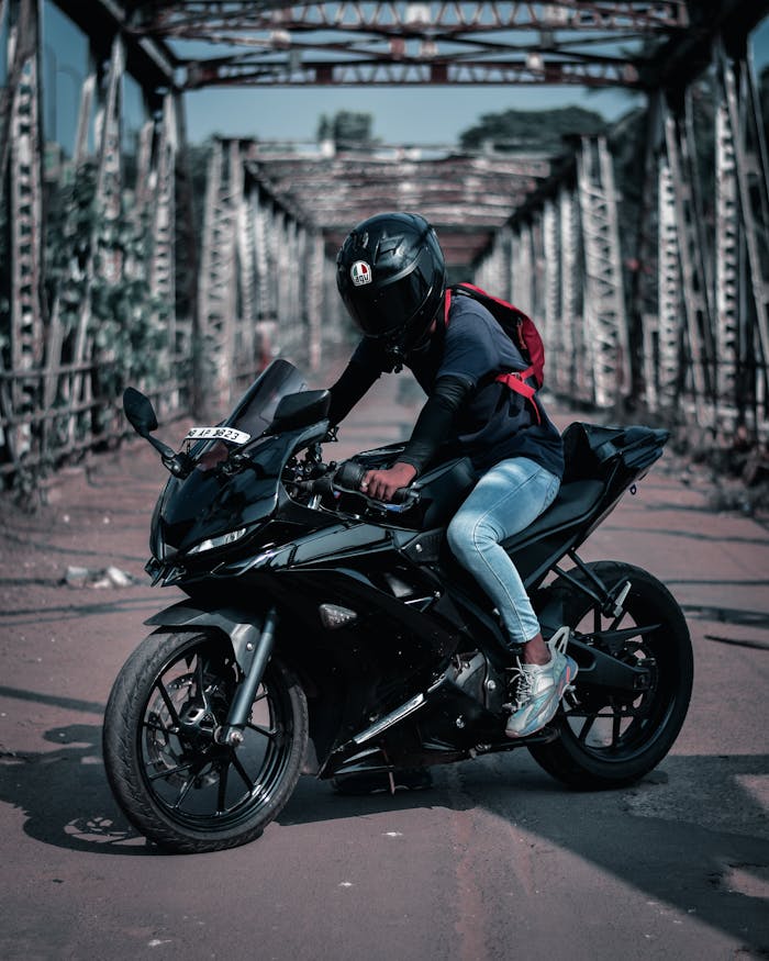 Man in Black Helmet Black Motorcycle